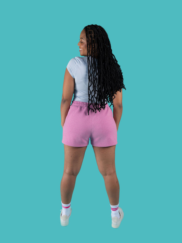 Back view of model wearing pink sweat shorts with drawstring made from the Tilly and the Buttons Cece joggers and shorts sewing pattern