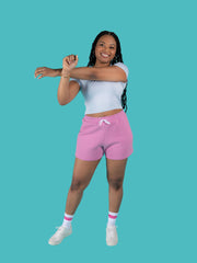 Model is wearing pink sweat shorts with drawstring made from the Tilly and the Buttons Cece joggers and shorts sewing pattern