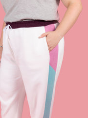 Close up on the colour block side panel and hidden pocket of the Cece joggers sewing pattern from Tilly and the Buttons