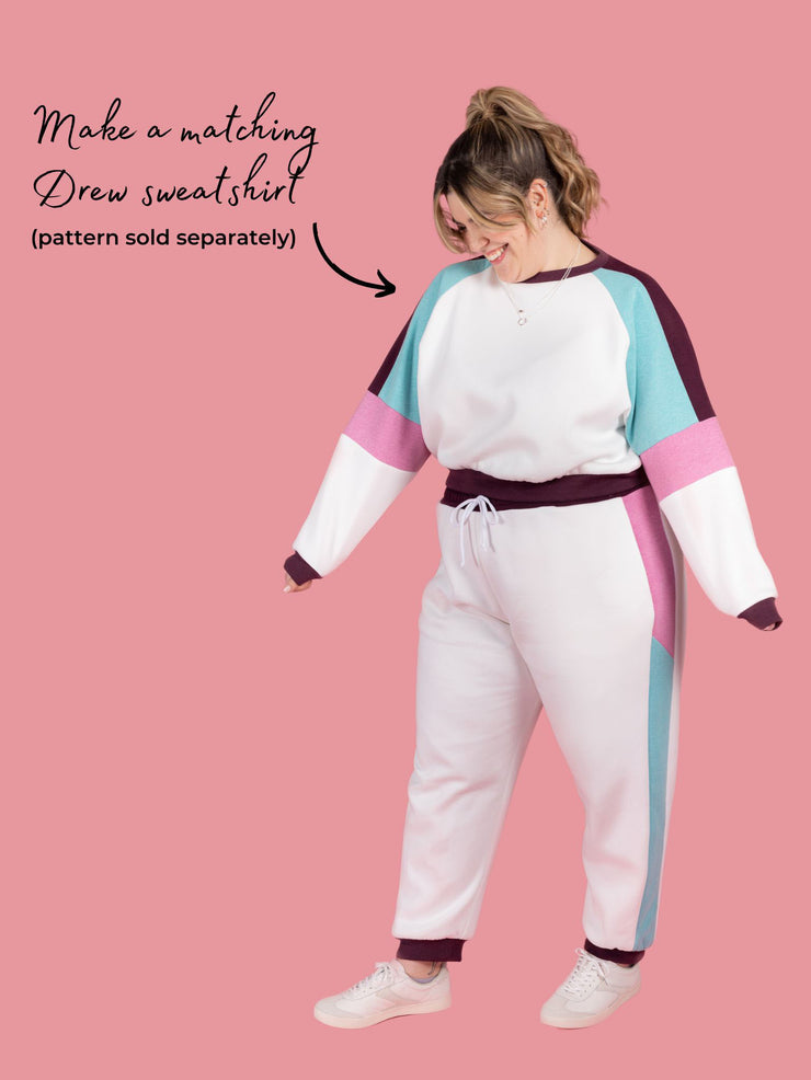Plus size model wears Cece joggers sewing pattern from Tilly and the Buttons in white with colour block side panel and pockets. Text says make a matching Drew sweatshirt pattern sold separately.
