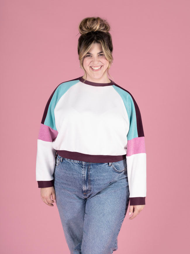 Model wearing the Tilly and the Buttons raglan sleeve sweatshirt in the colour block version, showcasing the stylish contrast of colours in this sewing pattern.