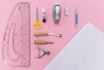 Various pattern cutting tools on a pink background