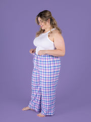 Jaimie pyjamas sewing pattern on plus size model in pastel tartan brushed cotton fabric