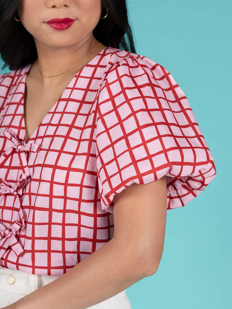Sewing pattern for a blouse with faux bow ties, hidden snaps, and puffball sleeves. Tilly and the Buttons.