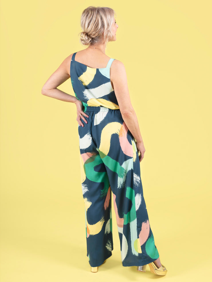Back view of model wearing a faux jumpsuit in a bold brushstroke print. The look was created with a matching top and trouser set, made using the Esti co-ord sewing pattern.