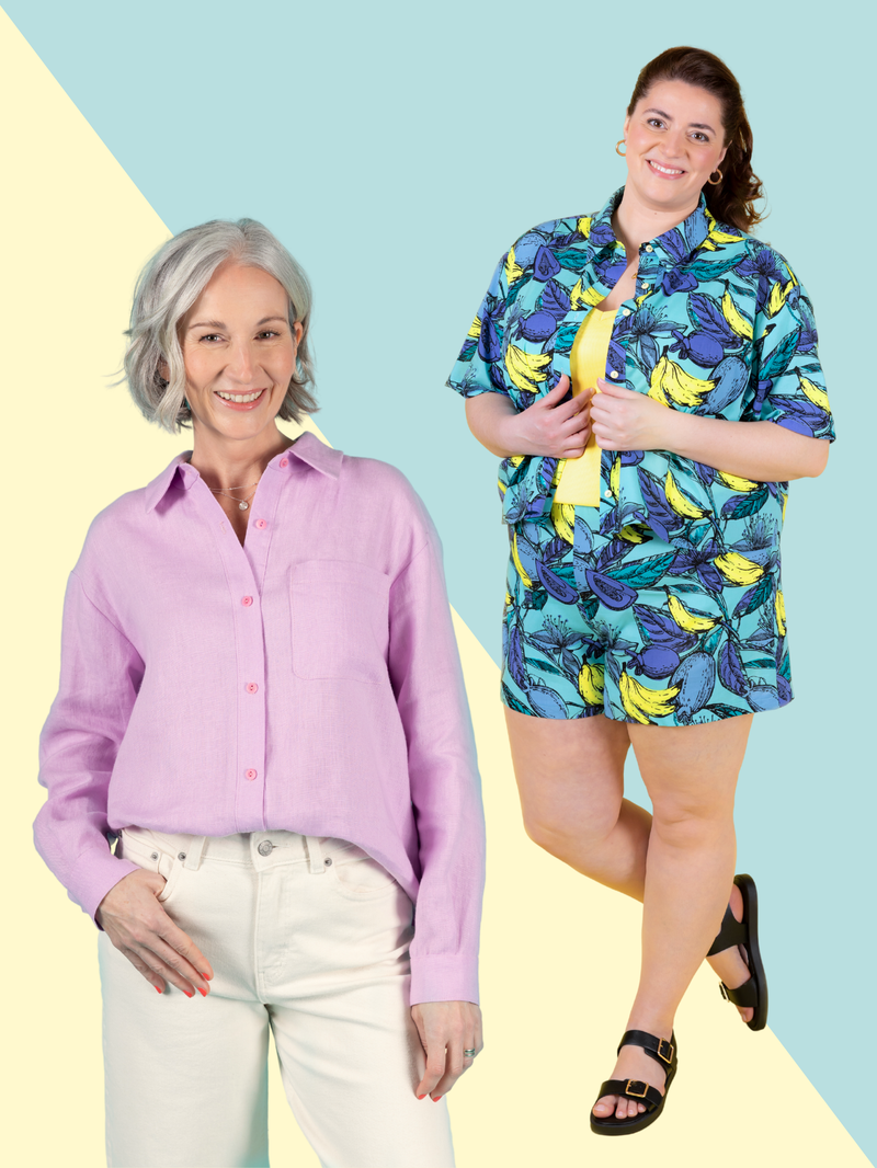 Two models wearing the Tilly and the Buttons Frida shirt sewing pattern. One model wears a plain lilac shirt half tucked into white jeans, with full length sleeves. The other model wears a colourful short sleeve shirt and matching shorts. On a two-tone blue and yellow background.