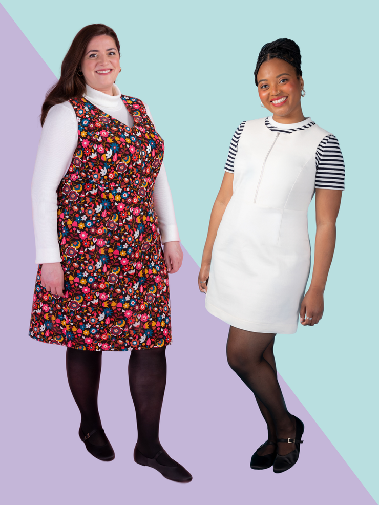 Two models wearing the Tilly and the Buttons Noa pinafore dress sewing pattern. One model wears a floral needlecord Noa pinafore with a V neck and knee length hemline. The other model wears a white denim Noa pinafore with a round neck line and mini length. 