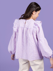 Back view of model wearing a lilac and pink gingham blouse, made using the Marnie sewing pattern in cotton.